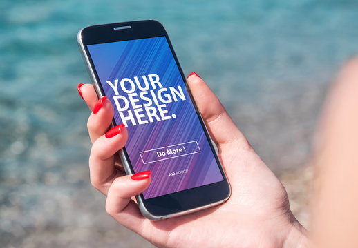 Close View Mockup of User Holding Smartphone on Beach