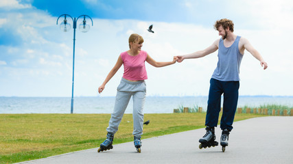 roller skater couple skating outdoor
