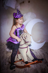 girl in the witch costume frightens.