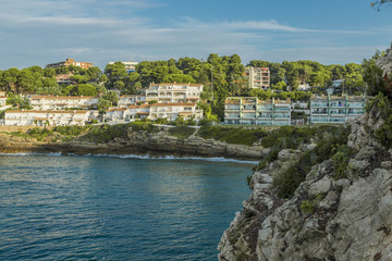 Fototapeta premium Salou, Spain. Beautiful panoramic view with beach and hotels in front of the sea . Sunny day in Spain.