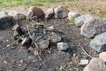 A place for a bonfire in the forest camp. Prepared a safe place for a bonfire in the forest.