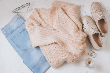 Autumn Arrives. Women fashion cloth and accessories. Trendy Cozy Jumper. Vanilla Pastel colors.