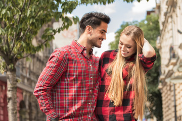 Smiling beautiful couple dating outdoors.