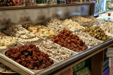 Different kinds of delicious sweets at market