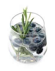 Glass of refreshing blueberry cocktail with rosemary on white background