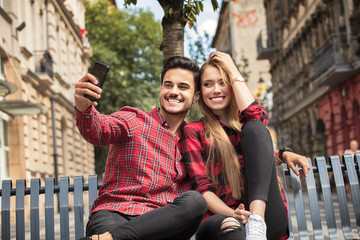 Smiling beautiful couple dating outdoors.