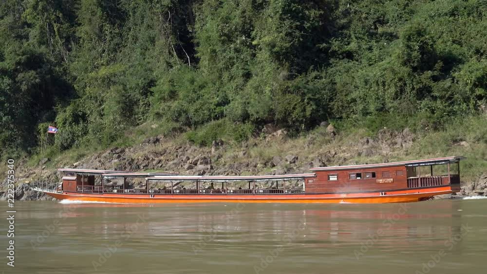 Wall mural Slow boat down the Mekong River in Loas