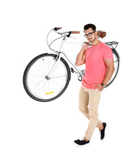 Handsome young hipster man with bicycle on white background