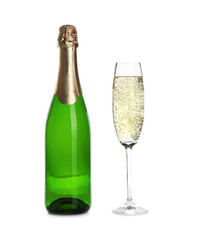 Bottle and glass with champagne on white background. Festive drink
