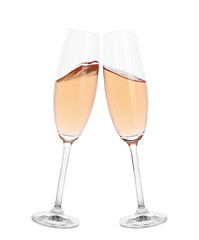 Toasting with glasses of rose champagne on white background
