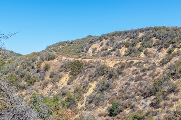 Trails for hiking to top of hills in California mountains on hot summer day