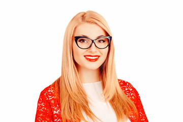 woman in glasses stands on a white background wall. Positive face expression.