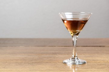 Whiskey or bourbon or mixed drink, neat, on a rustic, old, wood table