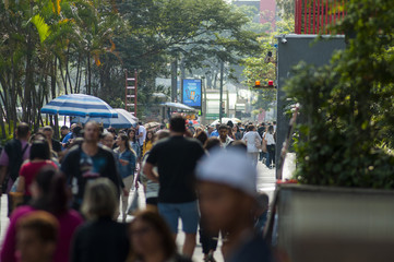 Fototapeta premium walking crowd on a side walk