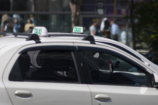 Two Taxis Side By Side