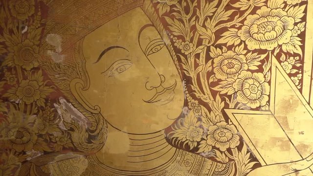 Indra gold painting on the temple wall inside Thai northern temple, famous fictional character in Hinduism belief.