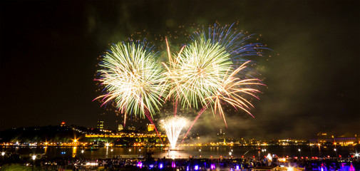 Fototapeta premium Bright fireworks over the Saint-Lawrence River near Quebec City during a Canadian summer festival.