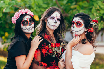 Portrait of Calavera Catrina. Young women with sugar skull makeup. Dia de los muertos. Day of The...