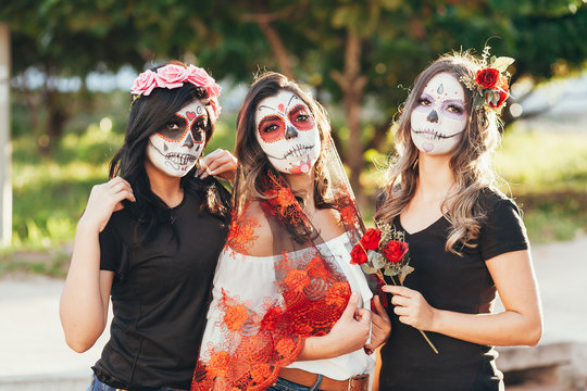 Portrait of Calavera Catrina. Young women with sugar skull makeup. Dia de los muertos. Day of The Dead. Halloween.