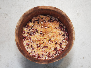 Sticky rice steamed with azuki beans on wooden bowl