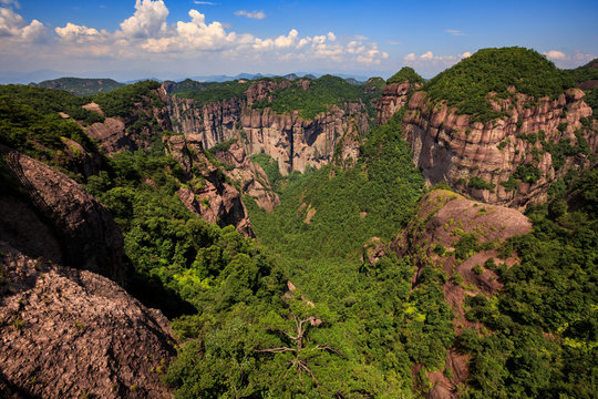 Shenxianju Scenic Area - Xianju County, Taizhou, Zhejiang Province China. Known as the "Place Where Spirits Reside", Chinese Canyon Scenery with steep cliffs,  aerial view above green forests below
