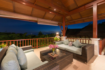 Fototapeta na wymiar Luxury interior design in living room of pool villas. wooden dining table , home, house