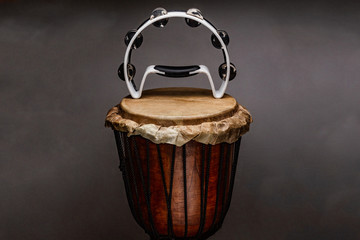 Obraz na płótnie Canvas ethnic percussion musical instrument jembe and tambourine