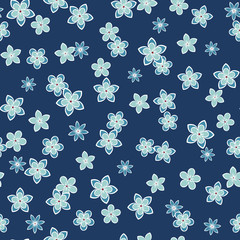 Seamless vector floral pattern with small flowers in monochrome blue colors. Ditsy print.