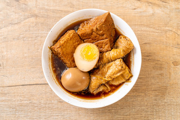 hard-boiled egg in brown sauce or sweet gravy