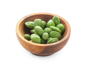 A wooden bowl of Stink Bean, also called Parkia speciosa, Bitter bean, isolated on white background