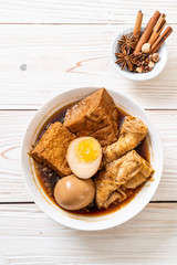 hard-boiled egg in brown sauce or sweet gravy