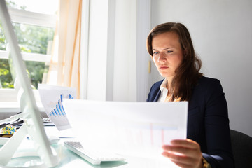 Businesswoman Looking At Documents