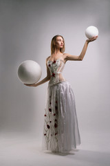 Girl in embroidered white corset and long skirt