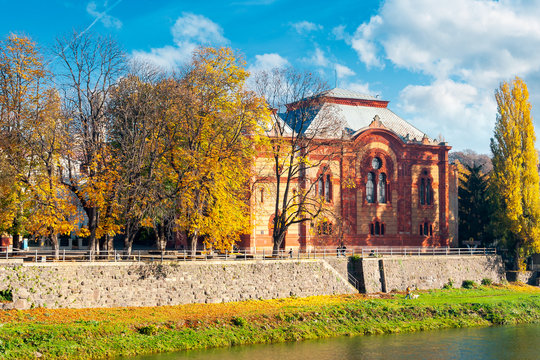 Uzhgorod, Ukraine - NOV 10, 2012: Philharmonic Orchestra Concert Hall on the bank of the river Uzh in autumn. former building of synagogue is a popular tourist attraction.