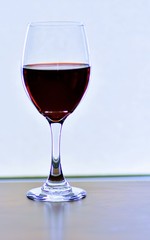 glass of red wine on white background