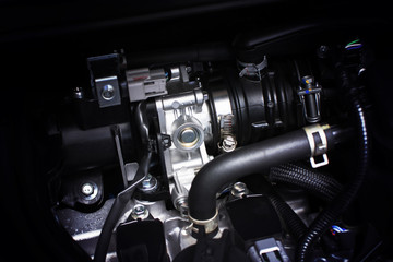 Fototapeta na wymiar Throttle body installed in gasoline part engine system of car, automotive part concept.
