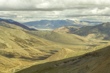 Fototapeta premium grandiose mountain valley with low dark sky
