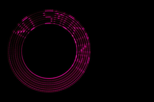 No smoking. Red LED inscription with abstract circular motion effect on a black background. Copyspace.