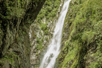 Fototapeta na wymiar wild waterfall in the rocks