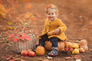 Cute little girl playing in autumn forest