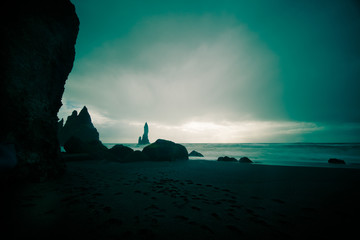 Naklejka na ściany i meble Rock formations Troll toes on black beach. Reynisdrangar, Vik, Iceland