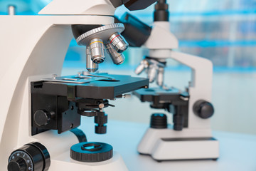 Four microscopes of different designs in the laboratory