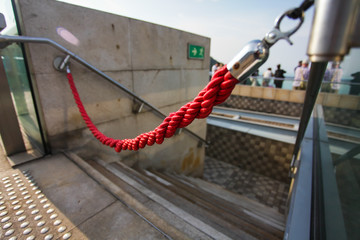 red rope like do not enter sign. unauthorized entry is prohibited. Closeup, shallow focus.