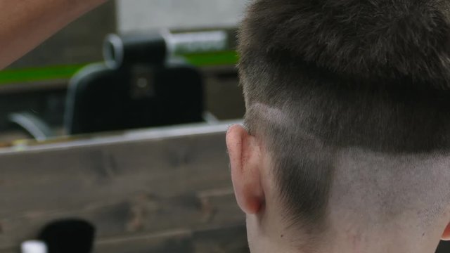 Barbershop. Stylish Man Makes A Haircut At The Barber.