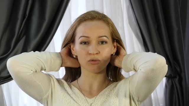 home self-massage, woman doing facial massage after a hard day work