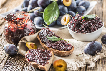 Breakfast from homemade plum jam bread and ripe plums.