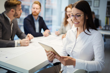 Business people working together on project and brainstorming in office