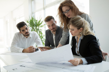 Fototapeta premium Team of architects working together on project