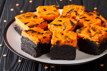 Halloween Cream Cheese Brownies cake delicious dessert for a festive treat closeup on a plate. horizontal