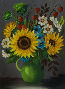 Eine grüne Vase mit verschiedenen bunten Blumen